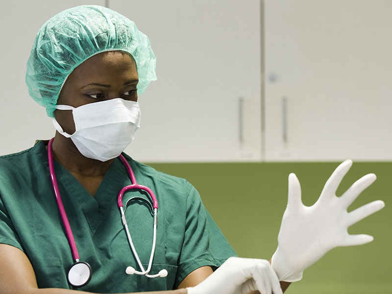 Clinician with mask and gloves