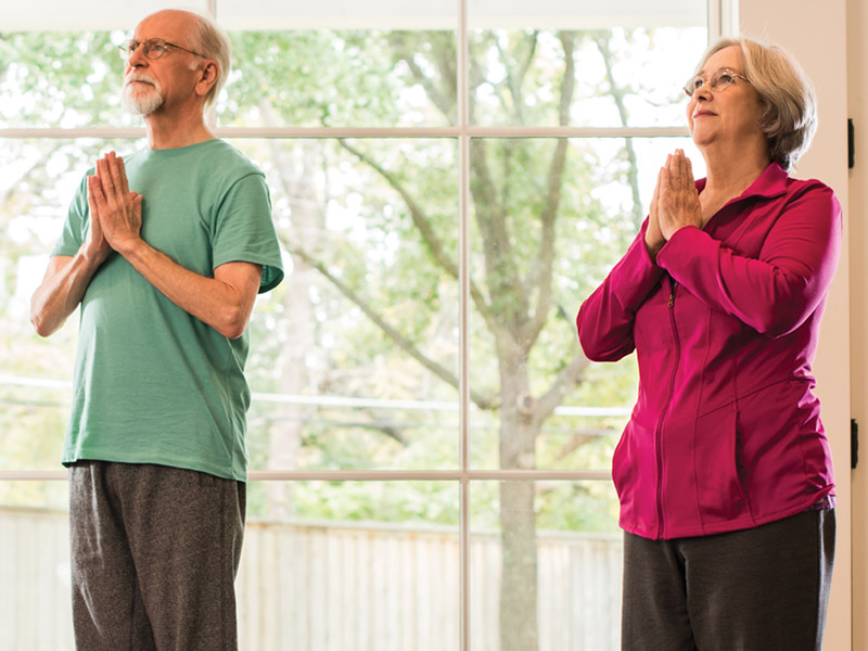 Man and Woman Doing Yoga