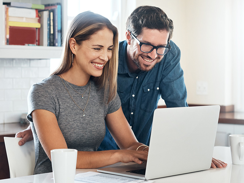 Couple using laptop