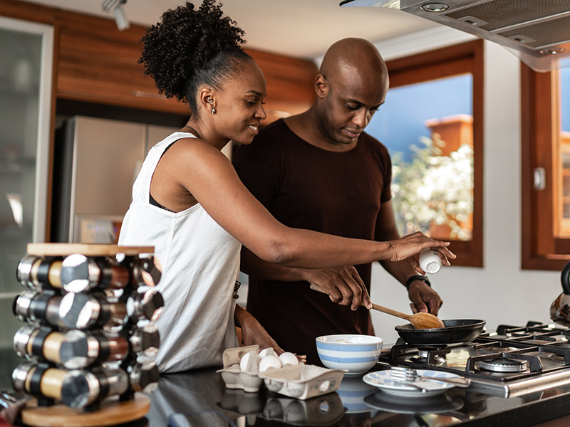 Couple cooking in kitchen