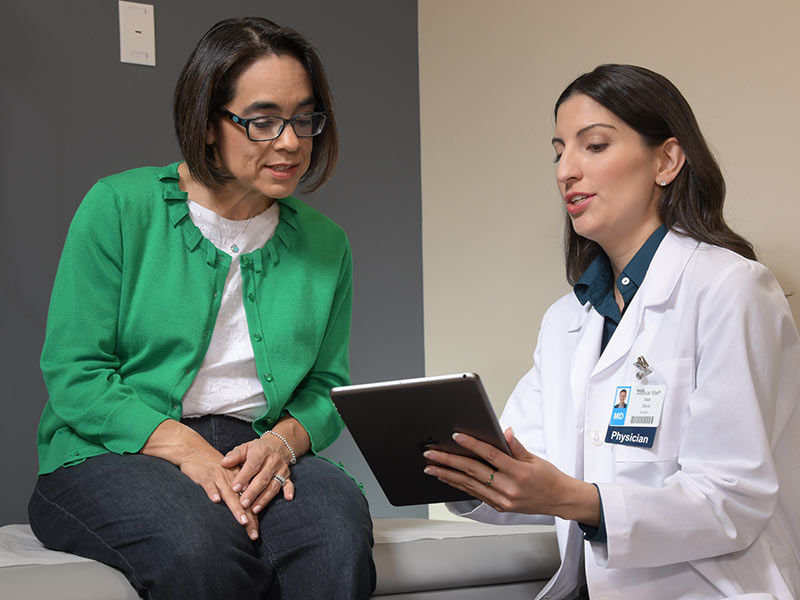 Doctor and Patient looking at tablet