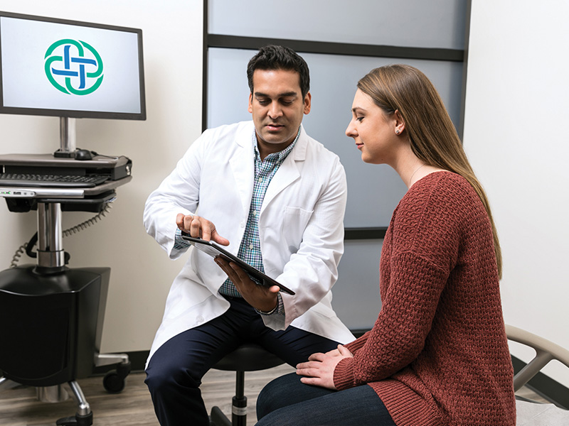 Doctor showing patient tablet
