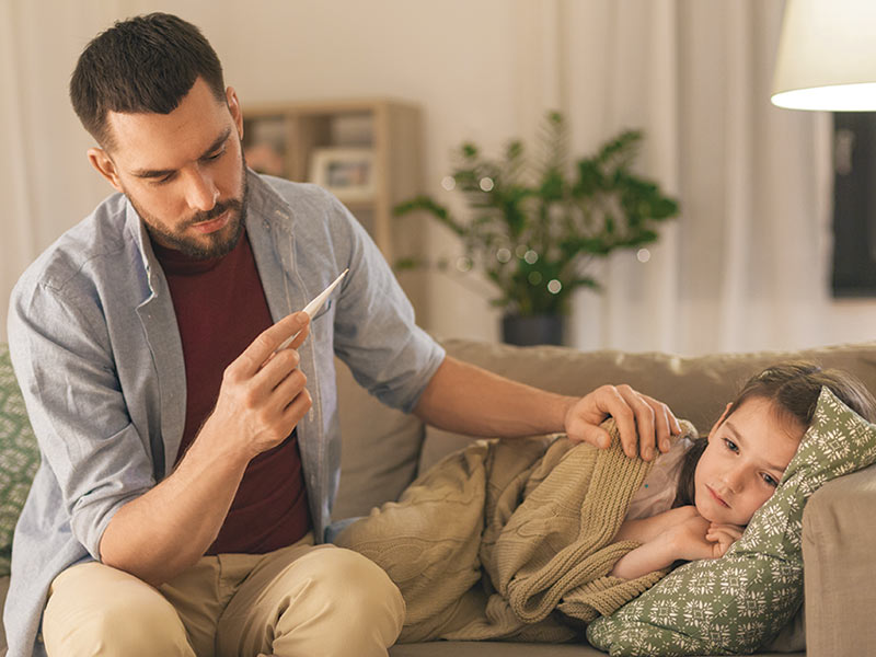 Father with daughter sick in bed