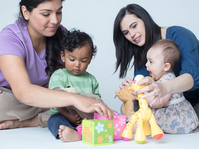 Group of two moms with toddlers