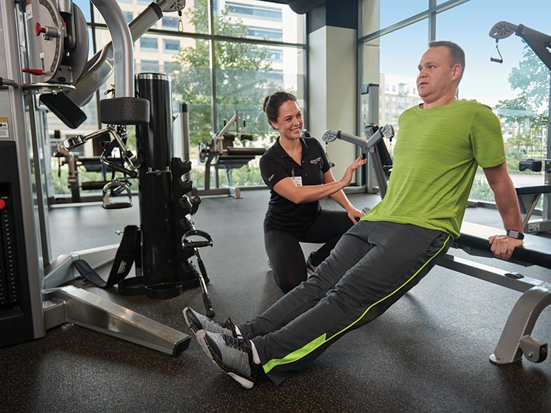 Man working out with trainer