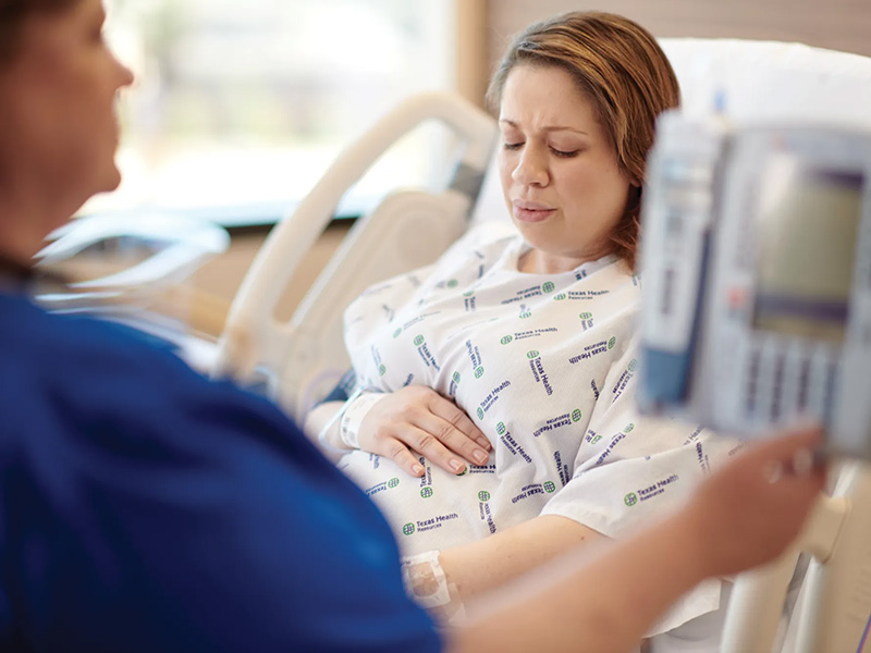 Pregnant mom in hospital bed