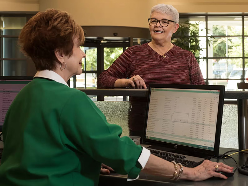 Volunteer helping guest