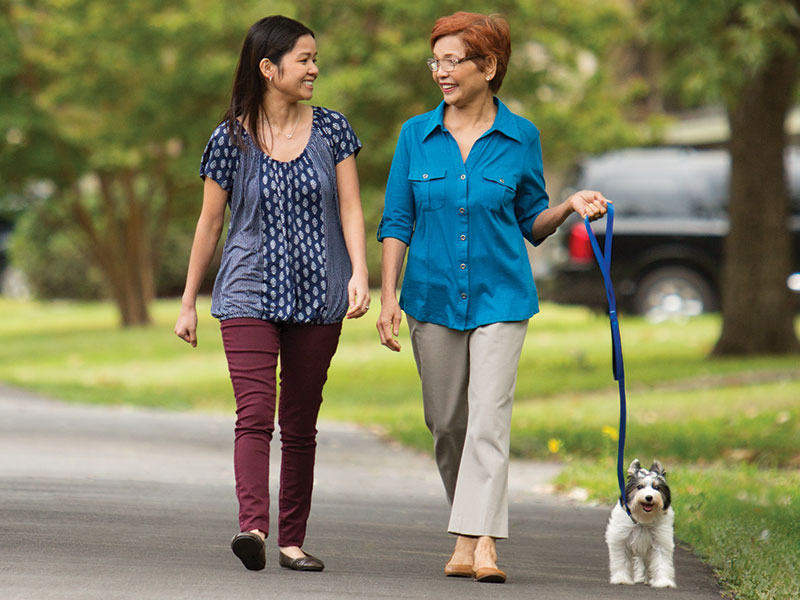 Women walking a dog