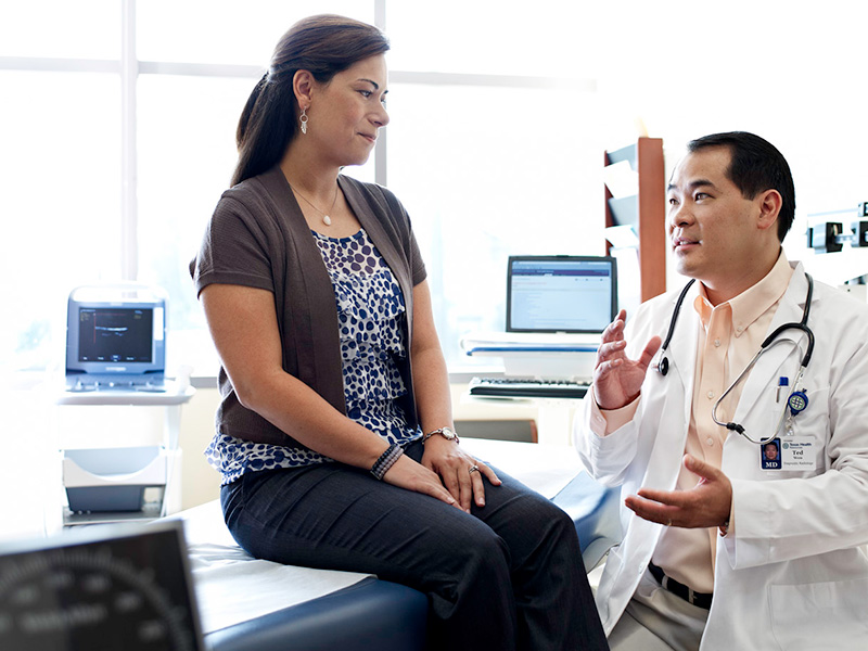 Physician consulting patient