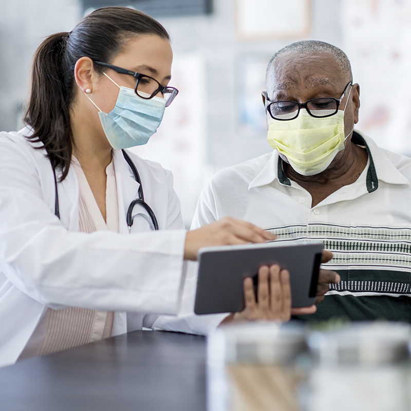 Provider with patient wearing mask