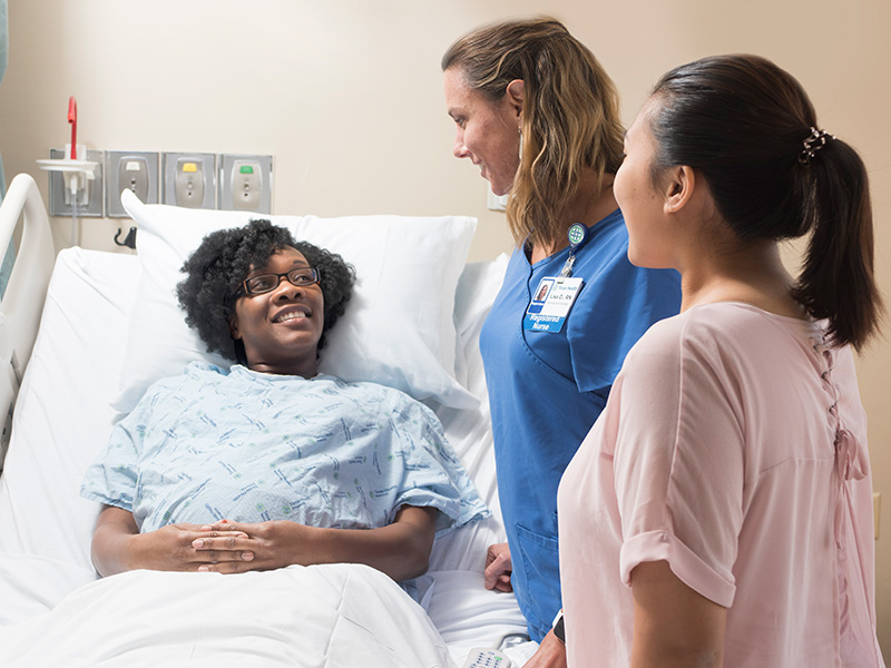 Patient with nurse and visitor