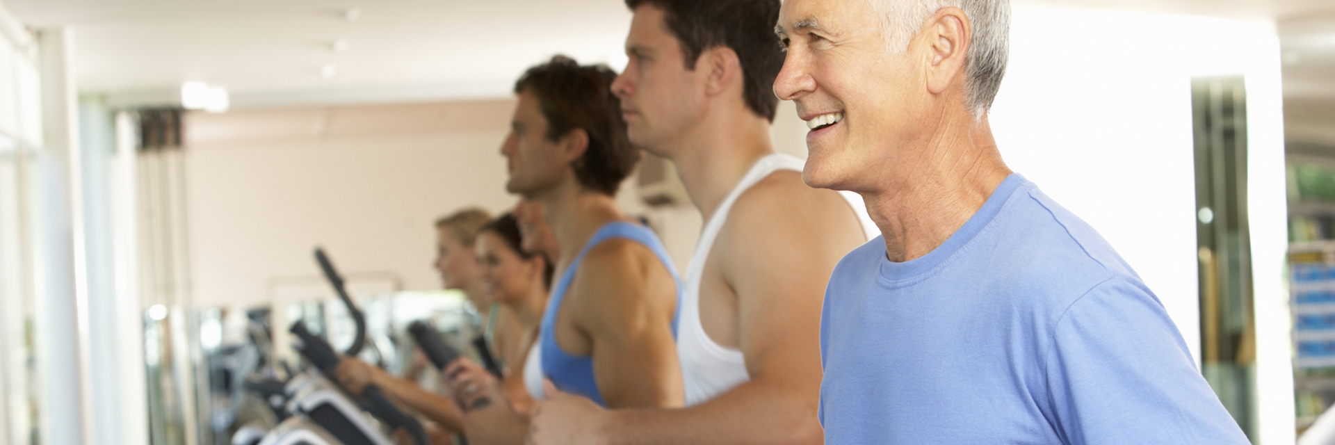 Group of men at the gym on treadmills
