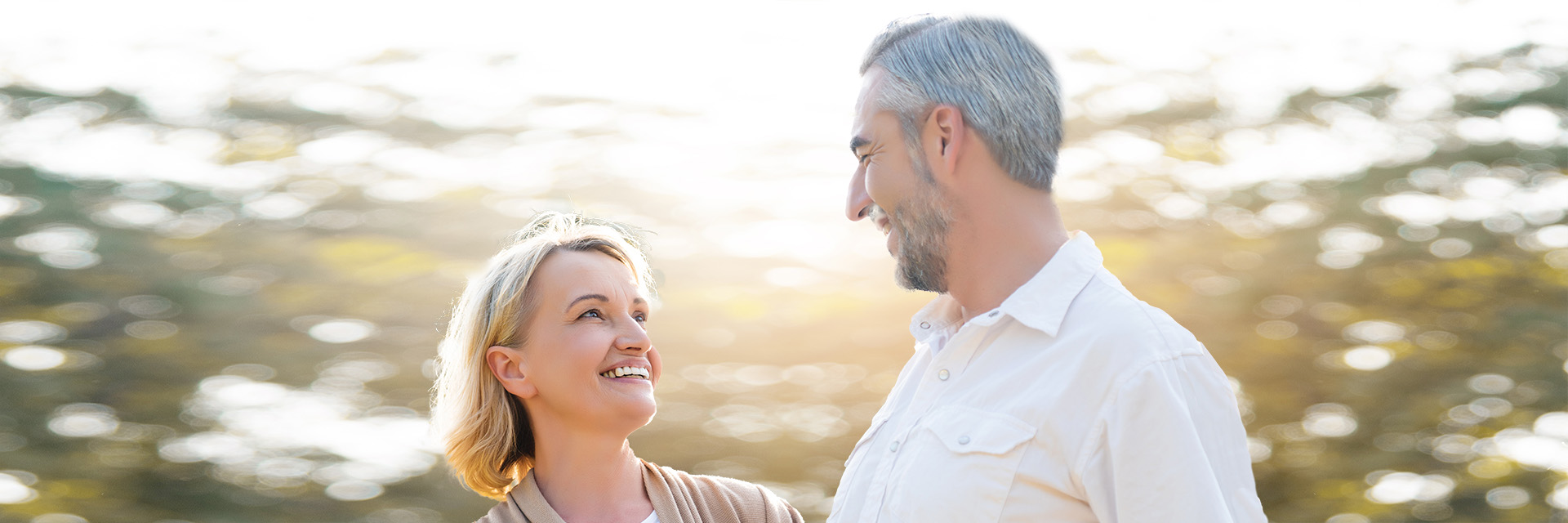 Mature couple outdoors smiling