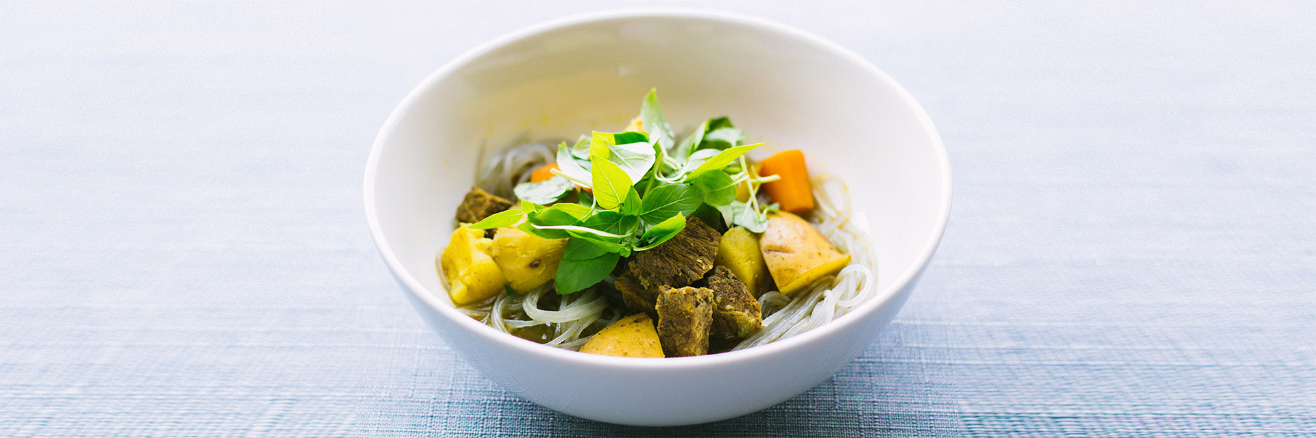 Healthy fruits and veggies in a bowl on a table