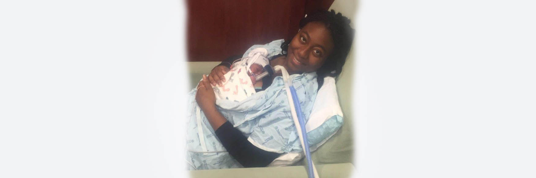 New mom holding 2 newborns in the Neonatal intensive Care Unit
