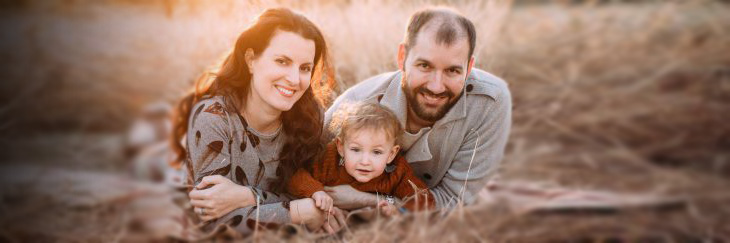 Family outdoors in grass