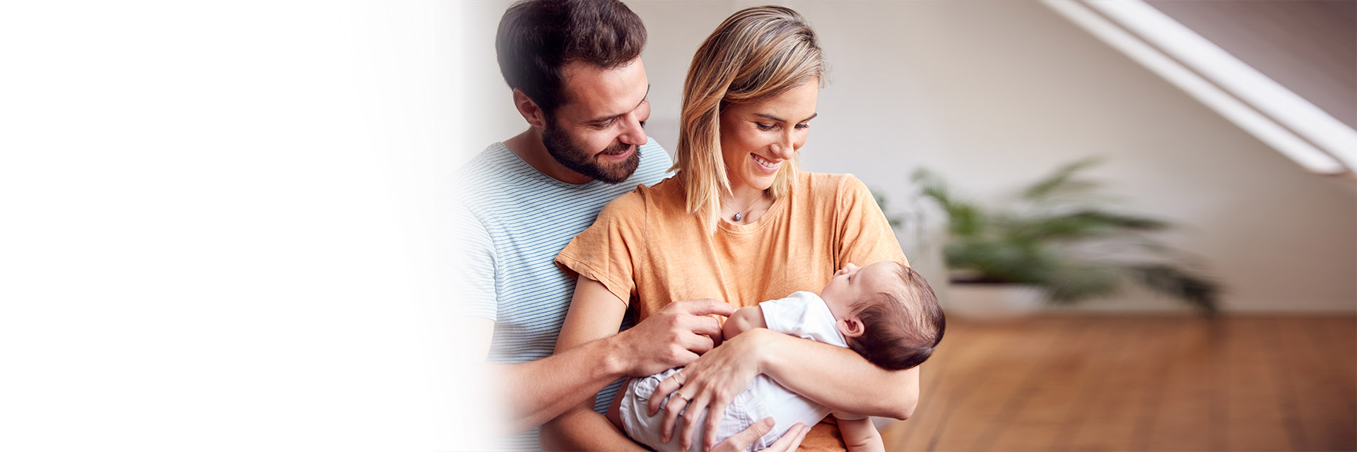 Parents holding infant