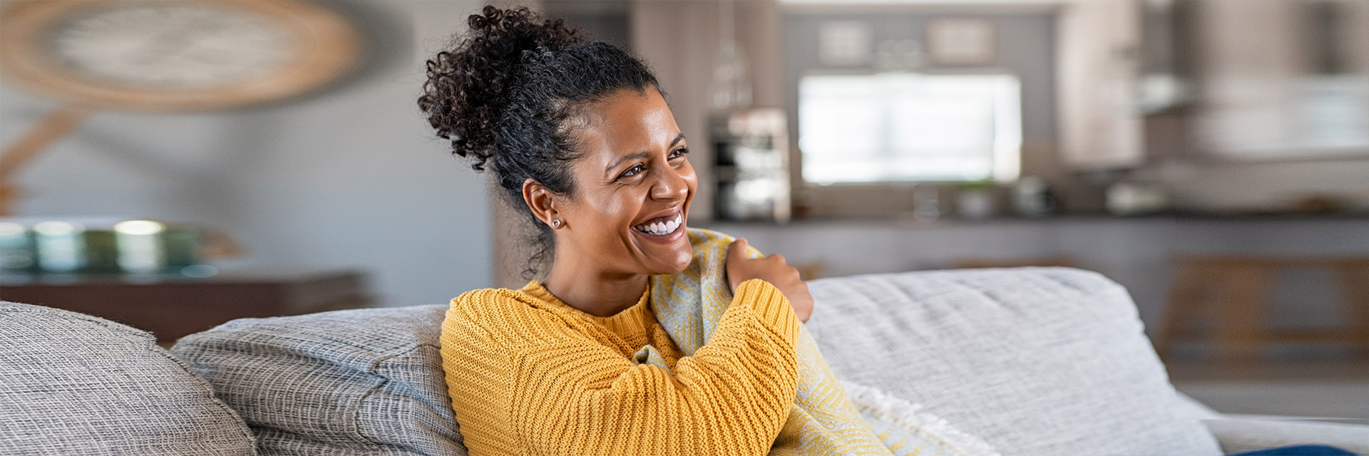 Woman smiling on the couch