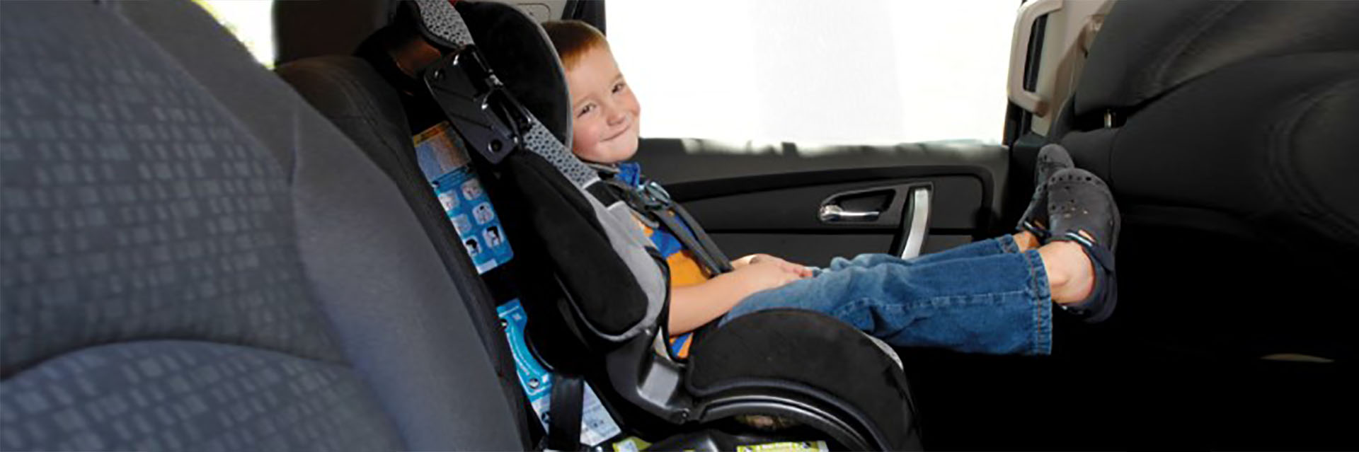 Toddler boy in car seat