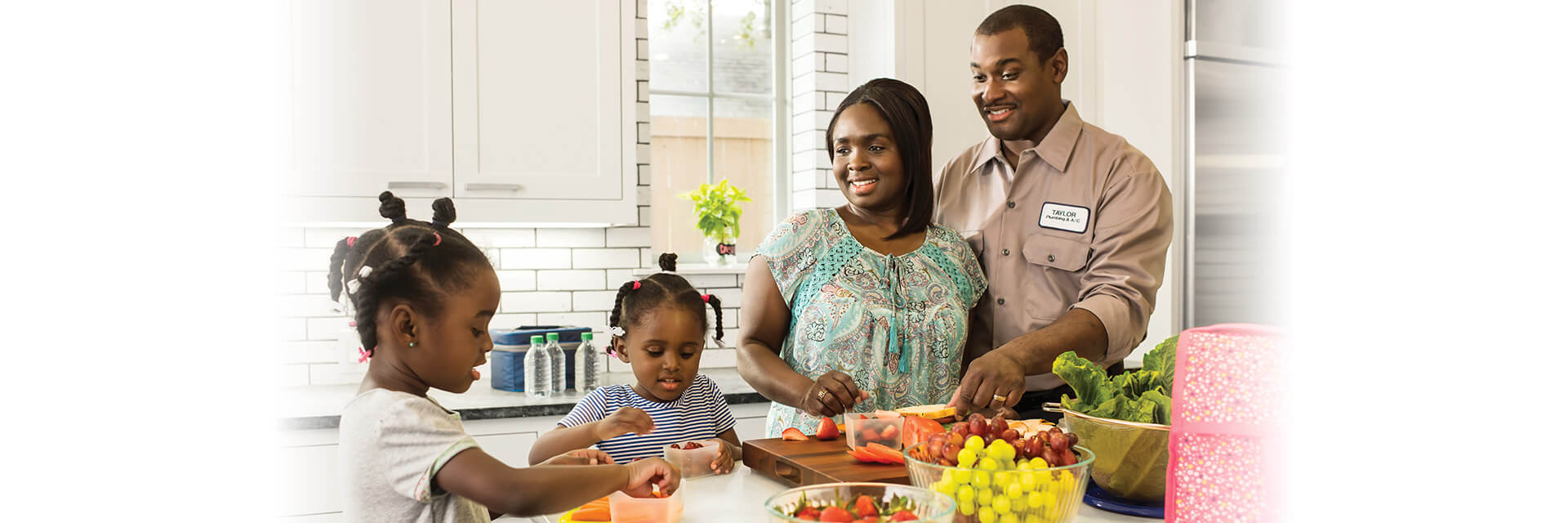Family in Kitchen eating healthy