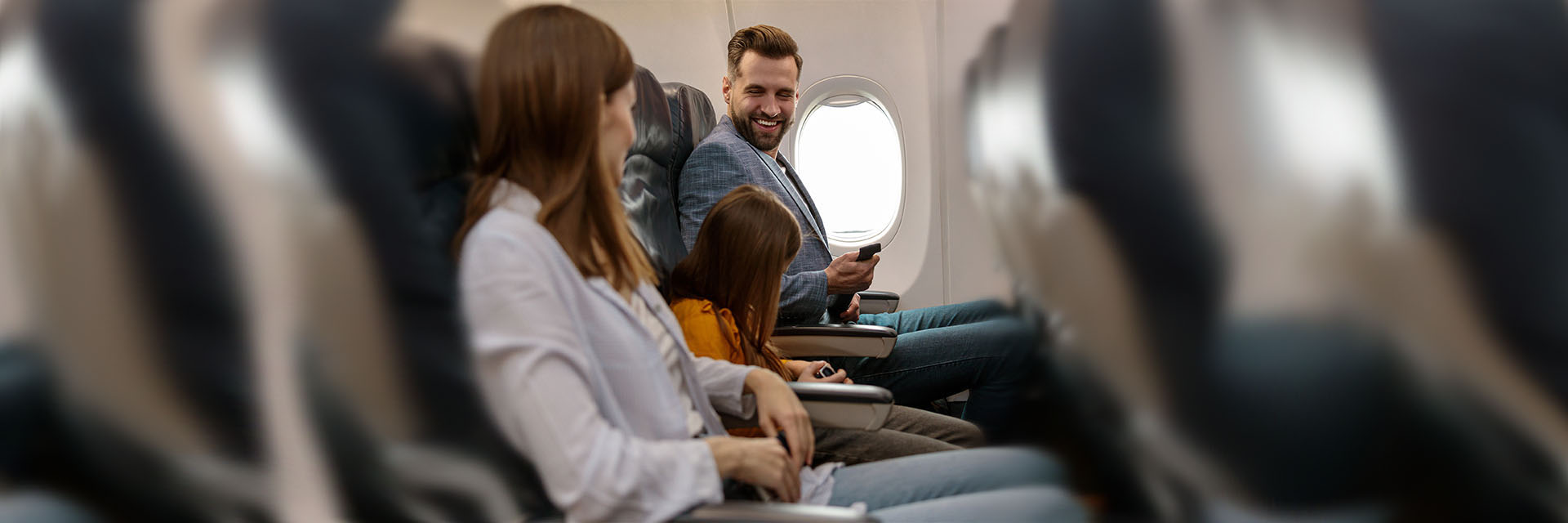 Family sitting on a plane