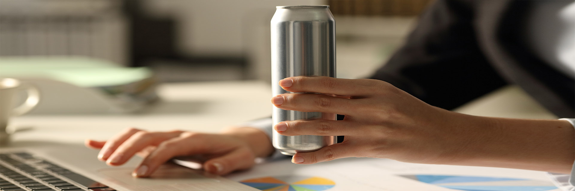 Female hand holding canned drink