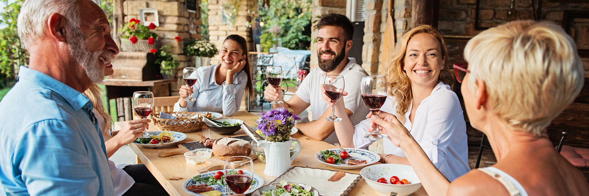 Multigenerational family dining outdoors