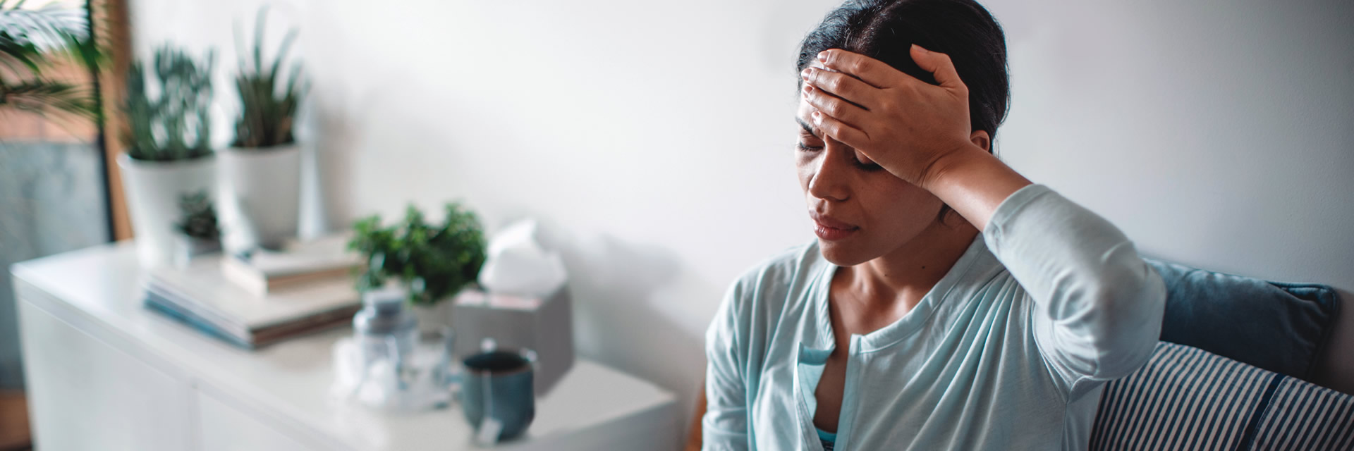 Woman grabbing her head with headache