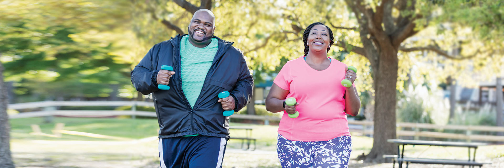 Heavy couple exercising outdoors