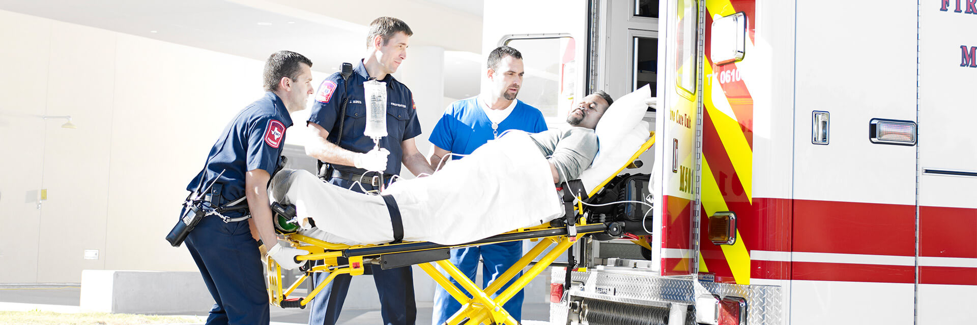 Man on stretcher in ambulance