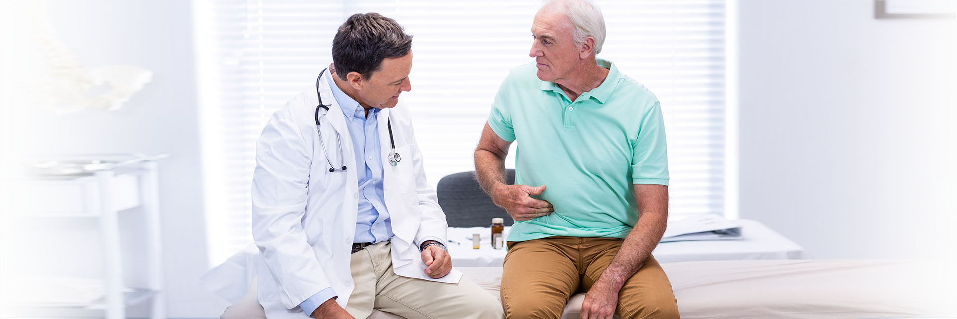 Mature man talking to his doctor