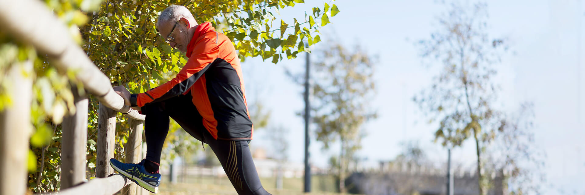 Mature man stretching during a walk