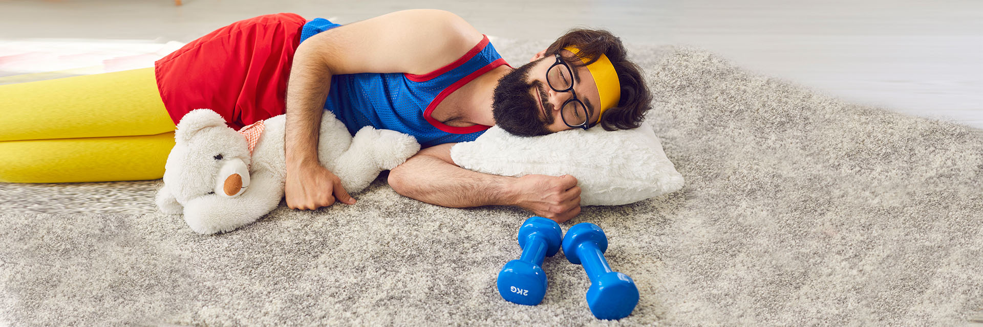 Man in exercise clothes laying on floor