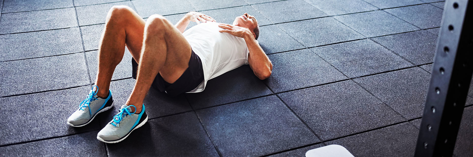 Man laying on gym floor