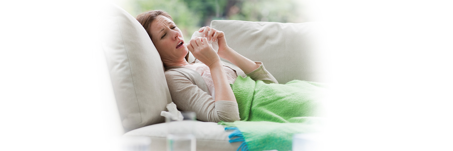 Sick Woman blowing nose