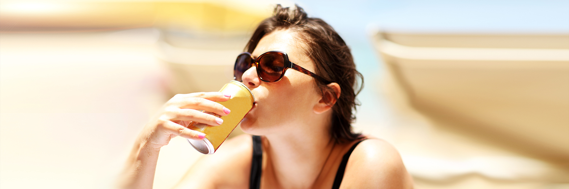 Woman drinking water outdoors