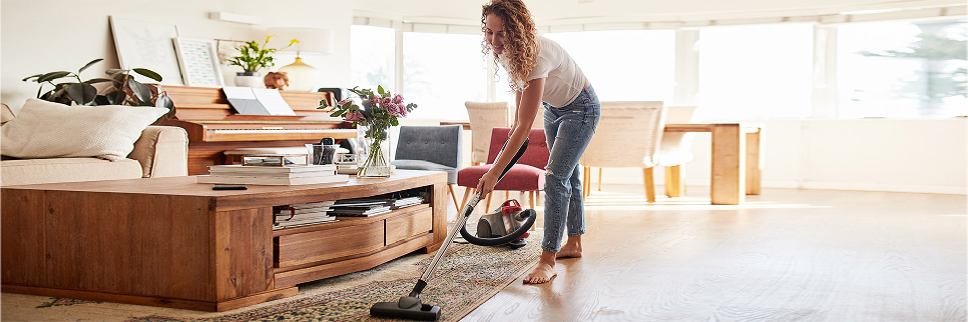 Woman vacuuming the floor