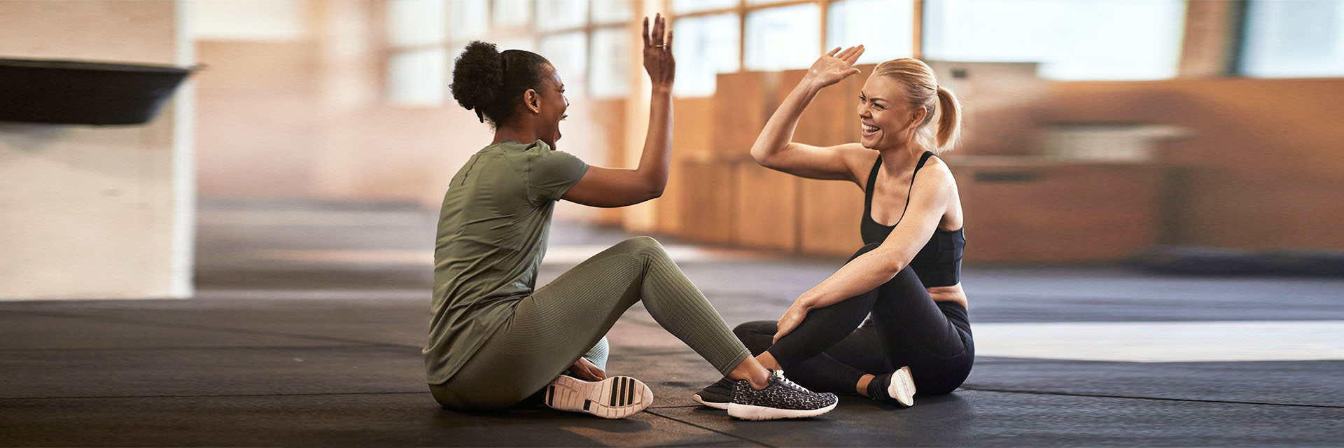 Woman giving high fives in the gym