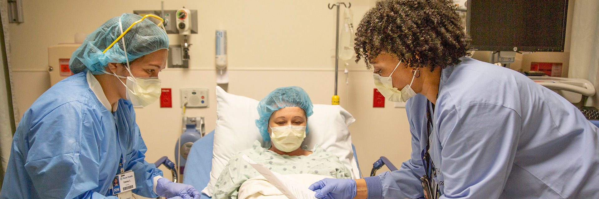 Provider with patient in bed