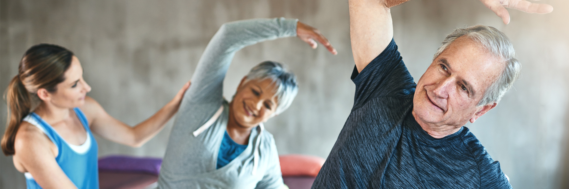 Adults Stretching in Exercise Class