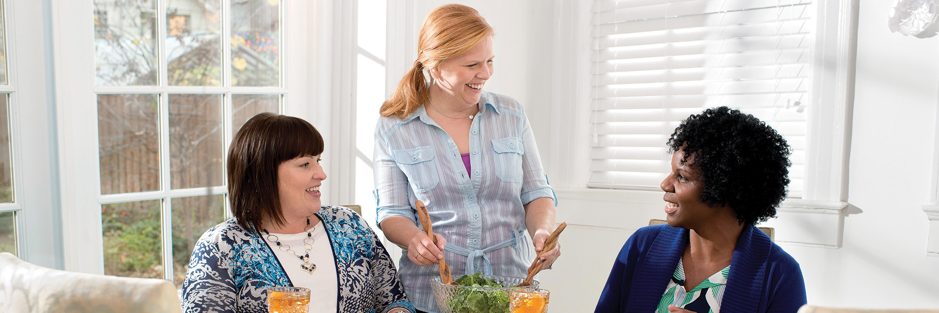 Three women eating healthy meal
