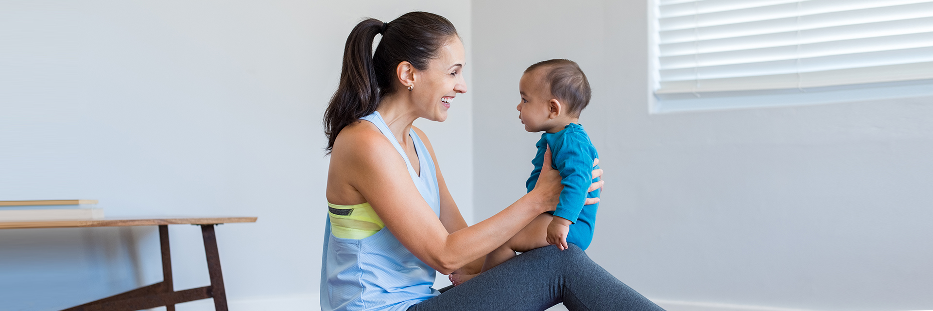 Mom playing with infant