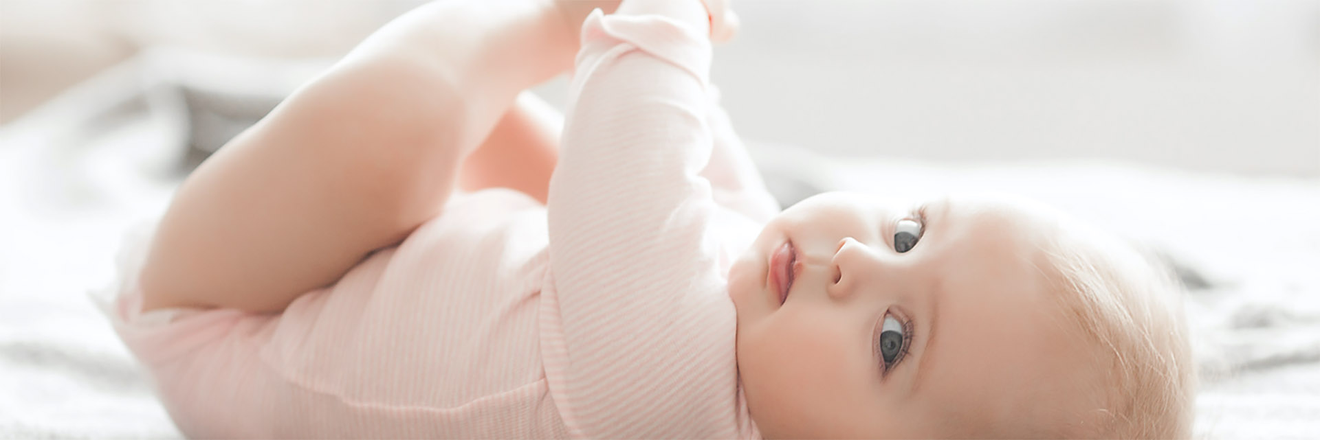 Baby laying in bed