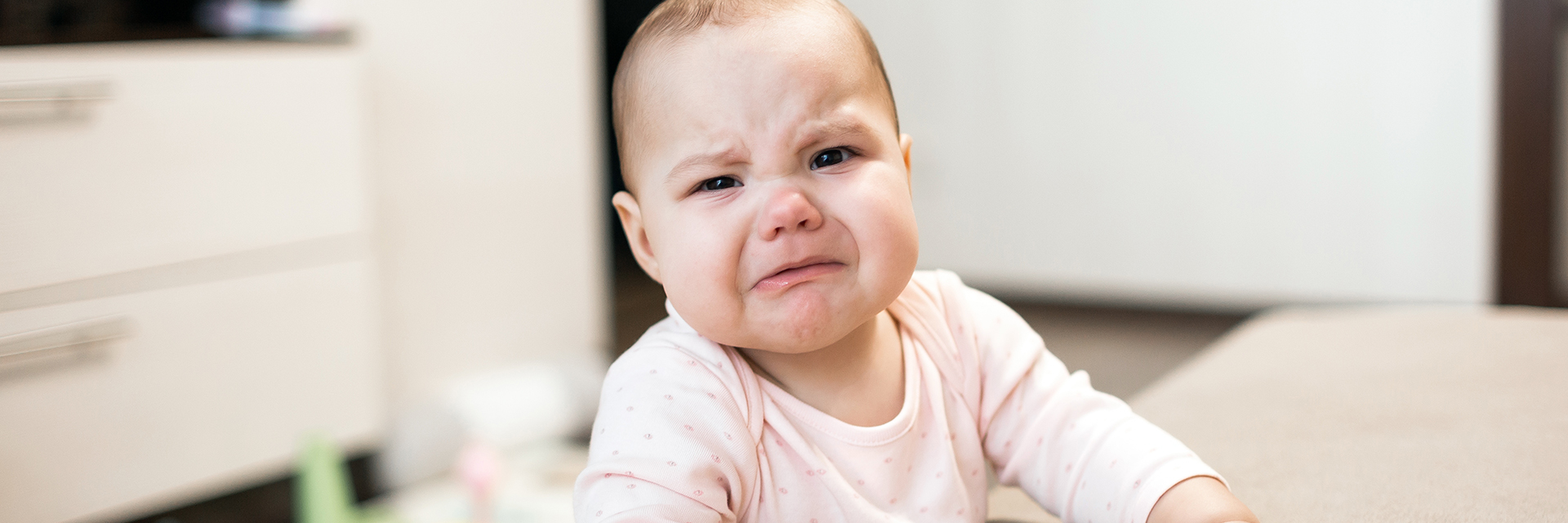 Crying upset infant girl