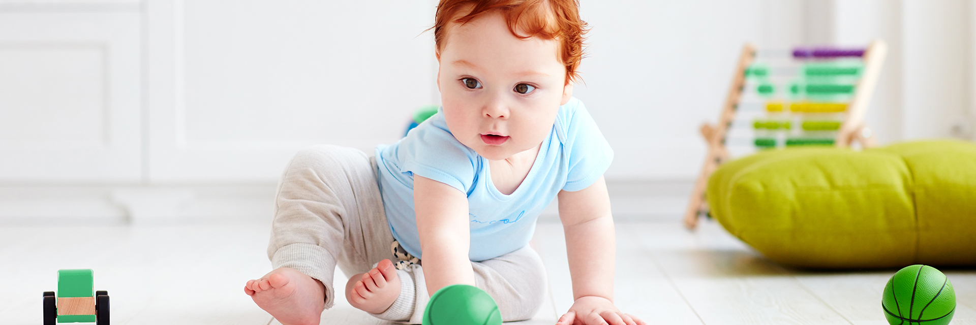 Toddler boy with balls