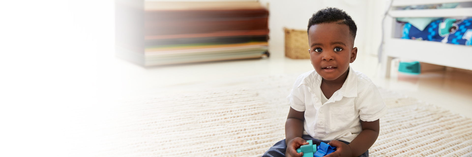 Baby boy playing on floor