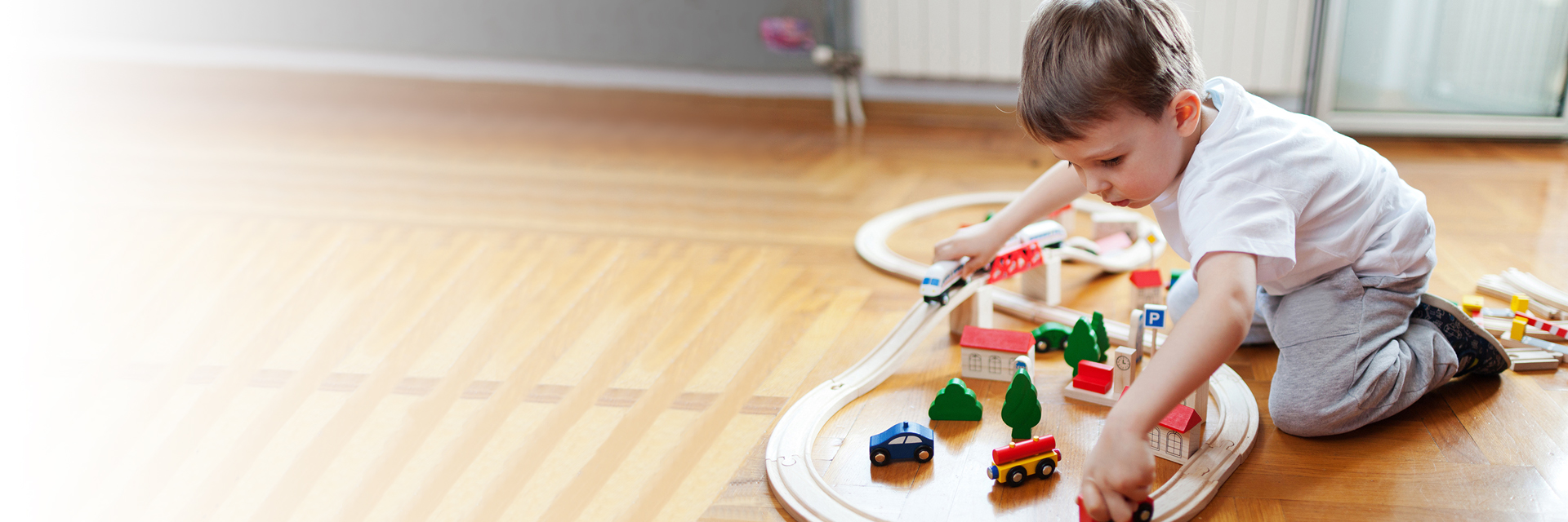 Little boy playing with cars