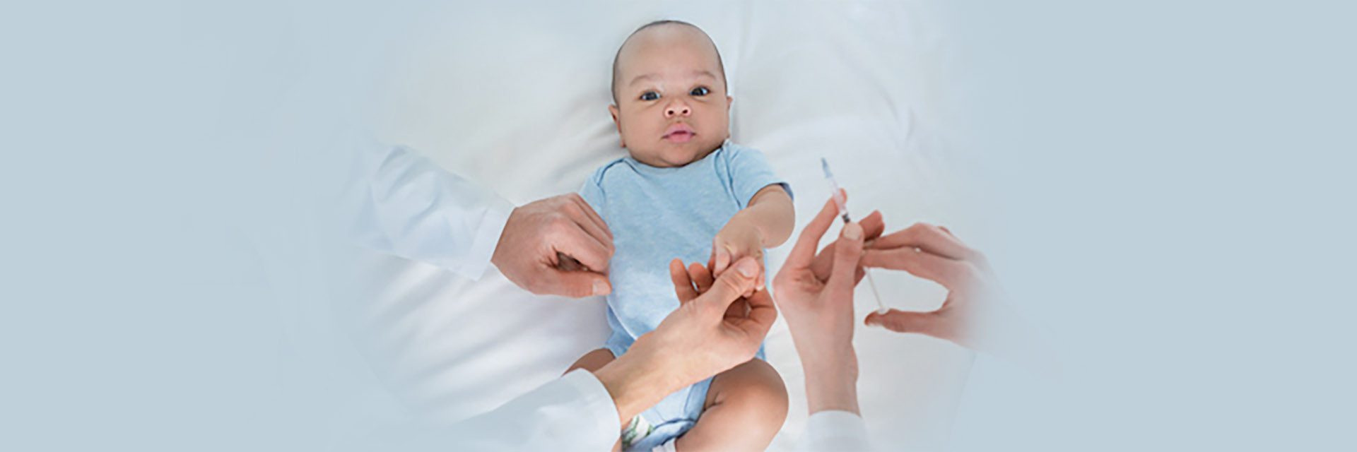 Infant boy getting a shot