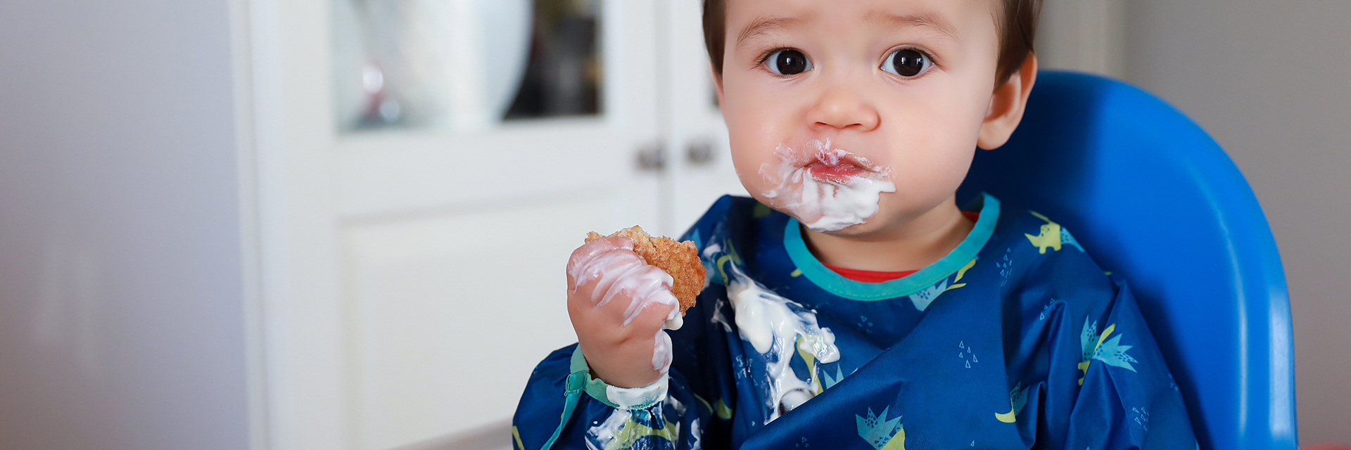 Little boy with icing on face