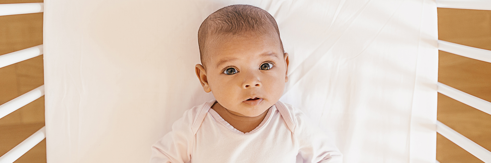 Baby laying in crib